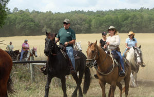 Vicki-O-and-Mike-with-Clermont-riders-coming-behind